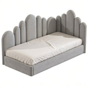 Gray upholstered bed with unique headboard design on a white background